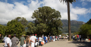 lines of people for water in cape town, south africa.
