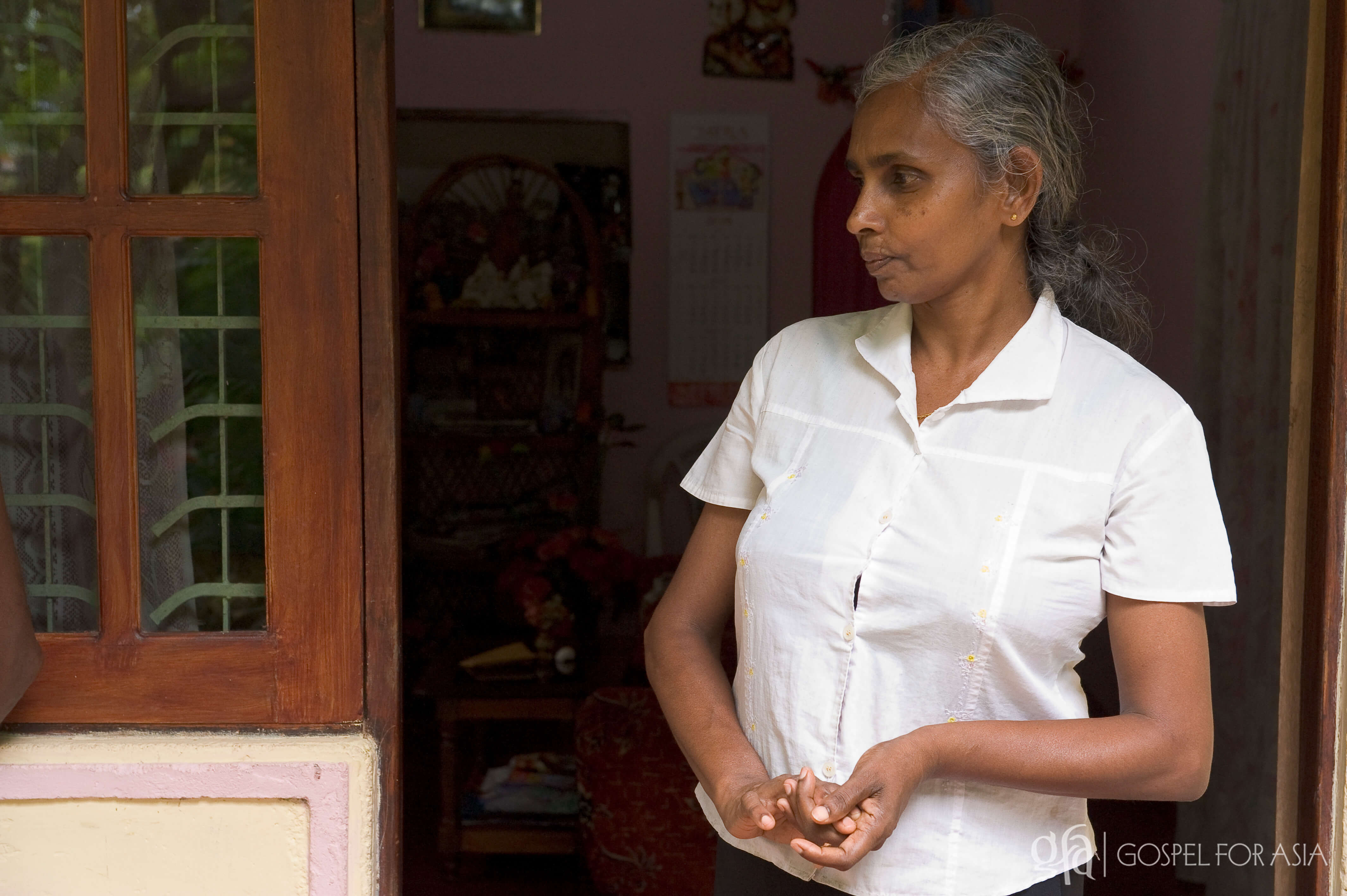 A mother in Sri Lanka, whose husband is having health problems, would face an uncertain future if he were not to improve.