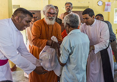 Dr. KP Yohannan helps distribute relief supplies to flood hit Sri Lanka.