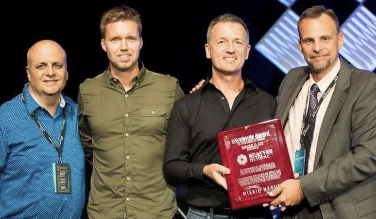Andrew Scott, OM-USA President and CEO (second right), received this year's eXcelerate Award from Missio Nexus CEO Ted Esler (right). Also pictured: Mike Rufo, COO of Pioneers (left) and Jonathan Thiessen, OM-USA Senior Vice President and leader of the Scatter Global initiative. 