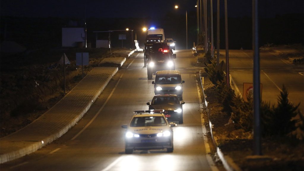 A convoy with a car carrying U.S. Pastor Andrew Brunson arrives for his trial in Izmir, Turkey, early Oct. 12, 2018. (AP Photo/Emrah Gurel)