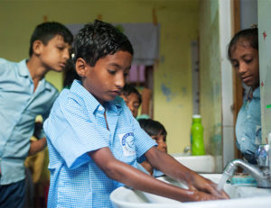 By learning how to wash his hands, this young student in GFA's Bridge of Hope Program helps his family to be more healthy.