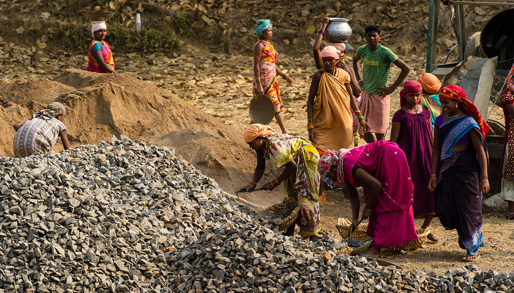 These women are working on road construction project in Asia. Around the world, women are more likely to be paid less than men and to face unemployment.