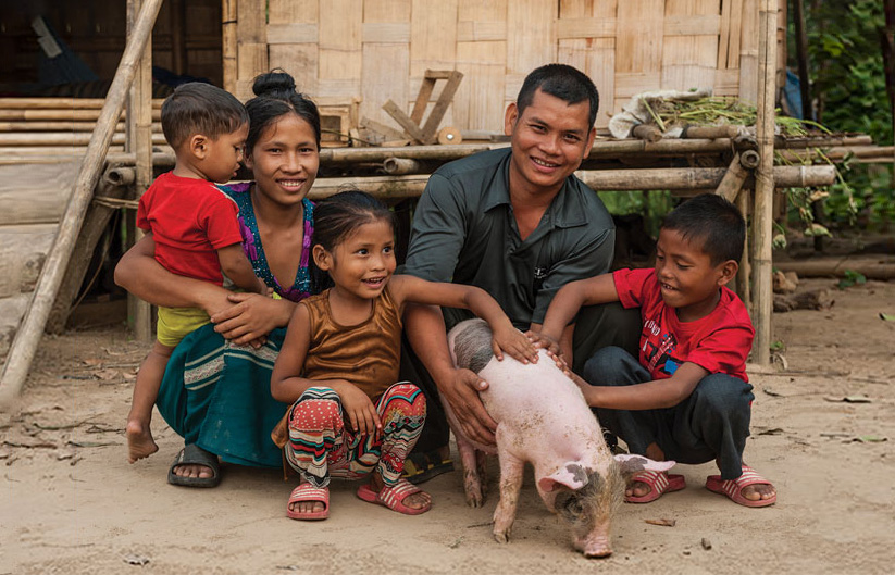 A family with a donated pig provided through GFA’s Christmas gift catalog. They are just one of thousands of Asian families helped to break out of extreme poverty, which is the focus of GFA’s “Forgotten Christmas” campaign.