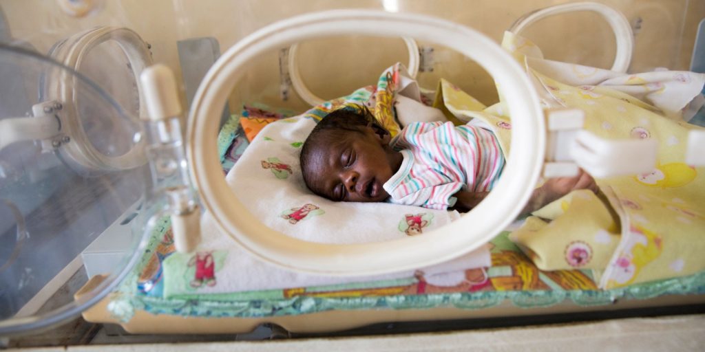 This newborn infant from South Sudan lies in an incubator, suffering from sepsis and jaundice and struggling to survive. His mother died giving birth. 