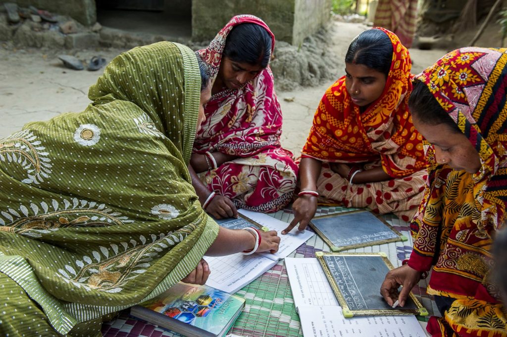 Sarada is teaching three women in a GFA-supported Women’s Literacy class.