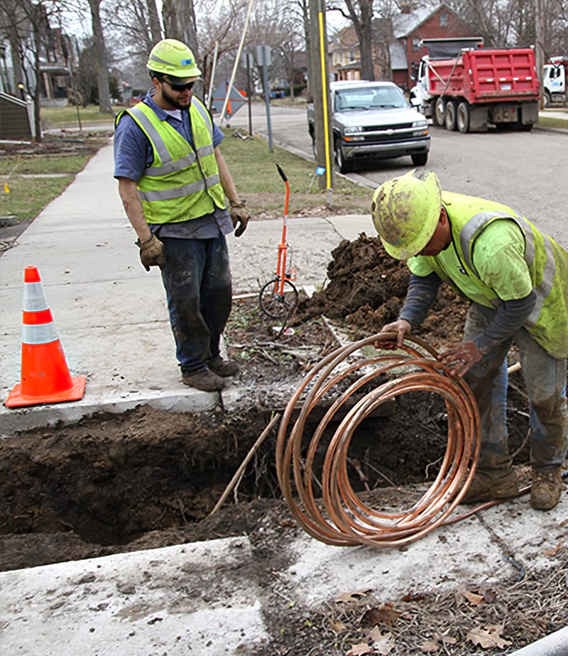 Workers laying new water pipes