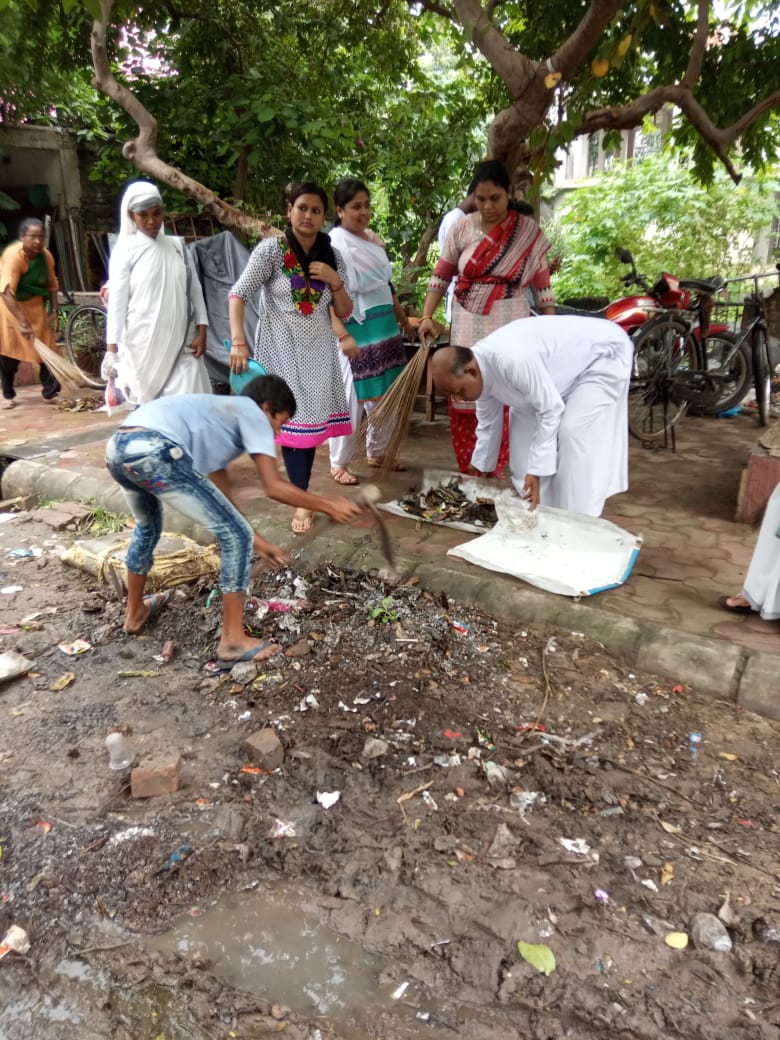 Gospel for Asia founded by Dr. K.P. Yohannan: GFA workers clean their community of garbage and standing water to eliminate breeding grounds for mosquitoes.