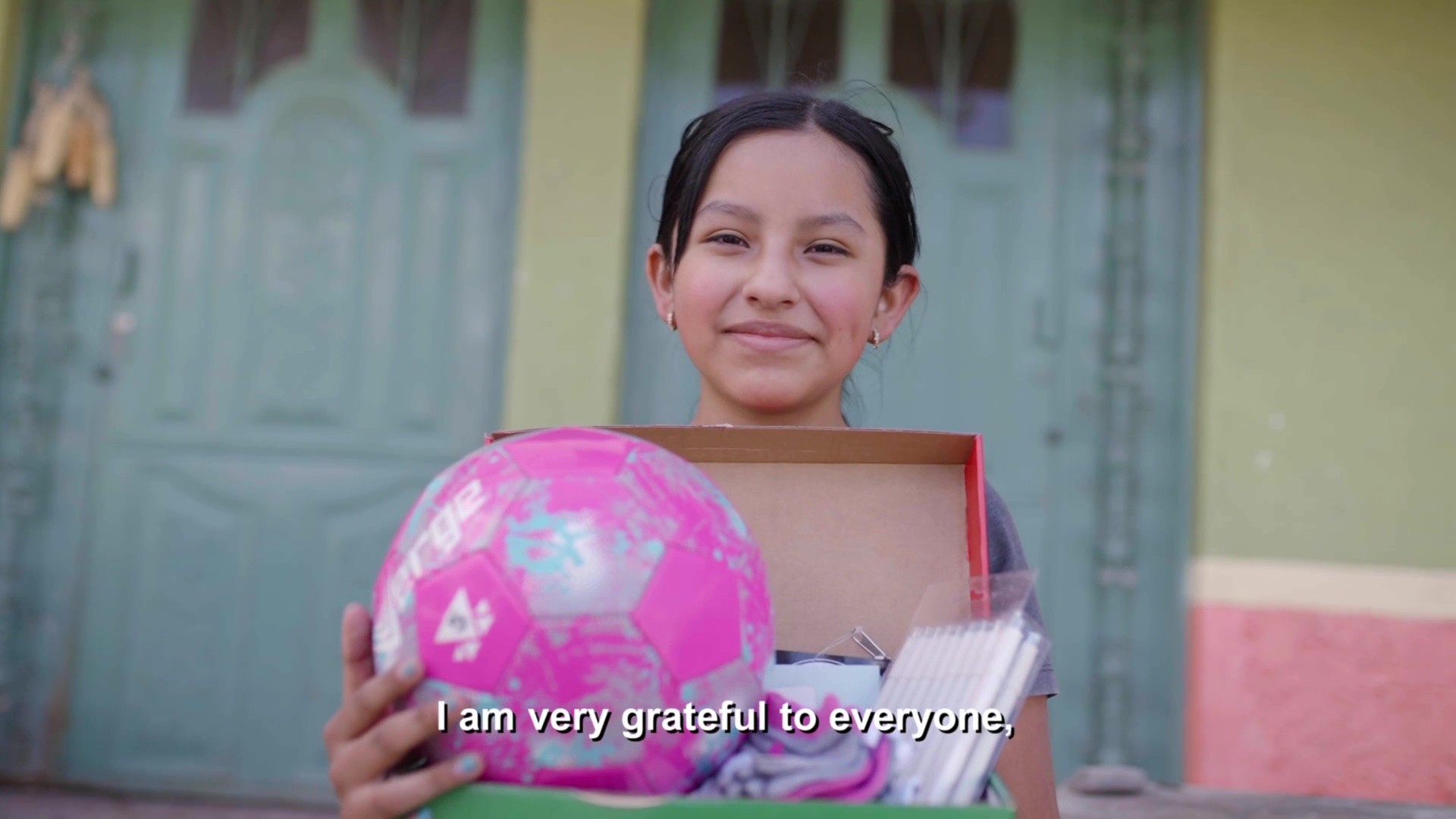 12 yr old girl in Ecuador, praises God for Operation Christmas Child shoebox gift received filled with colored markers and other surprises
