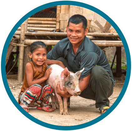 Family in poverty with an income generating gift of a pig
