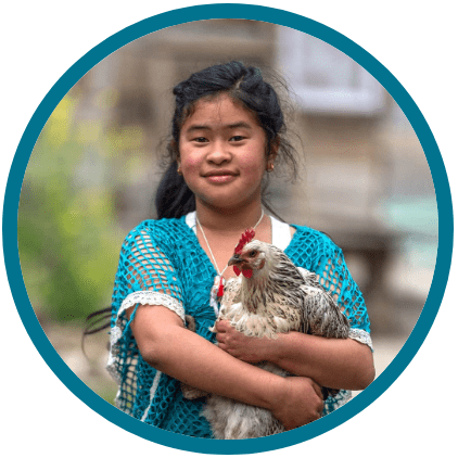 Girl and an income generating gift of a chicken